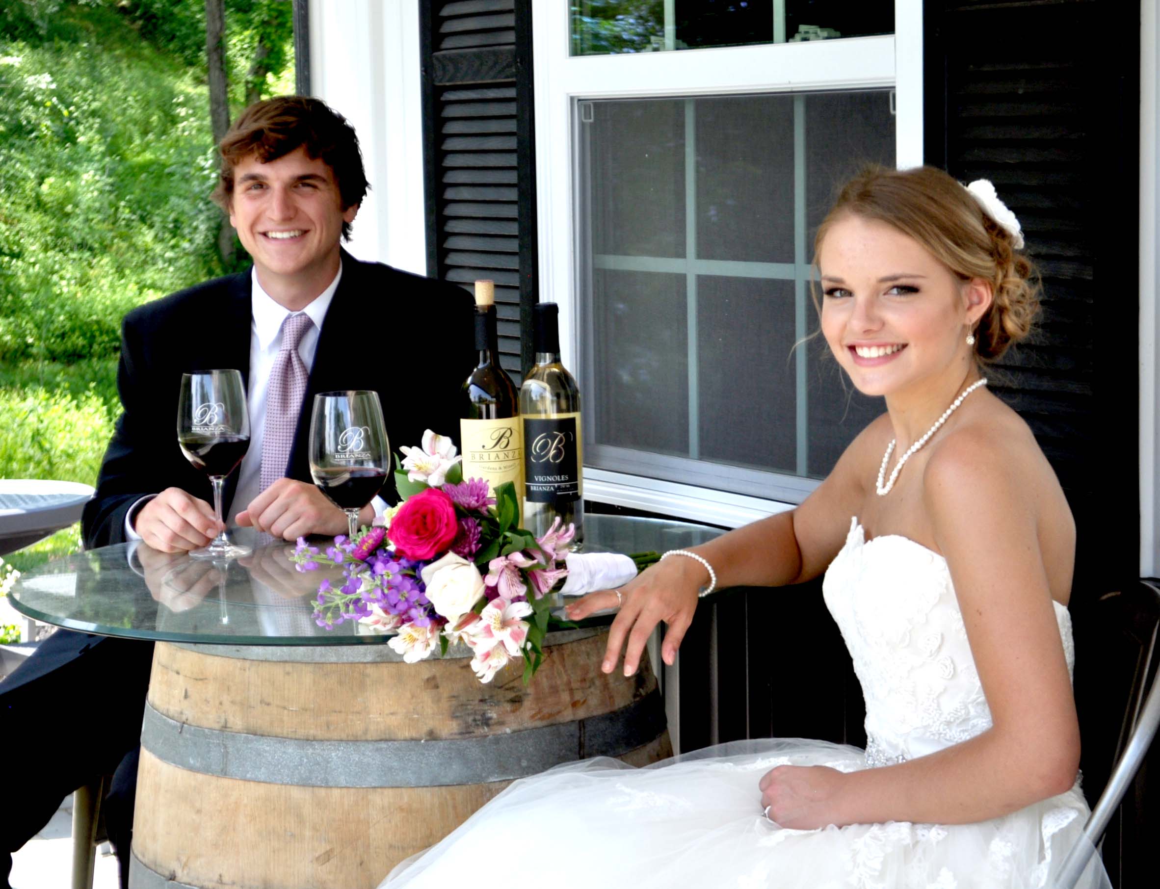 Bride and Groom sitting on tasting room porch